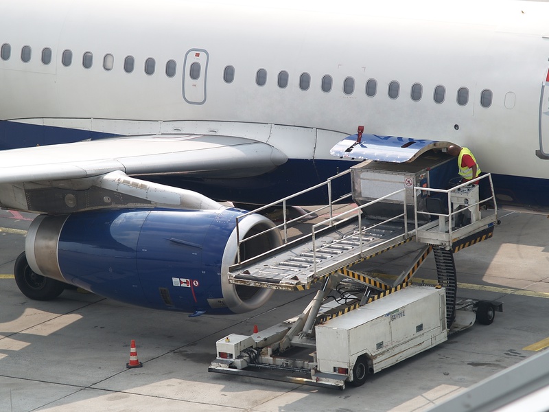 Worker loading aircraft